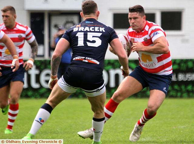 I'VE GOT MY EYES ON YOU . . . Luke Adamson looks to sidestep a Swinton Lions defender