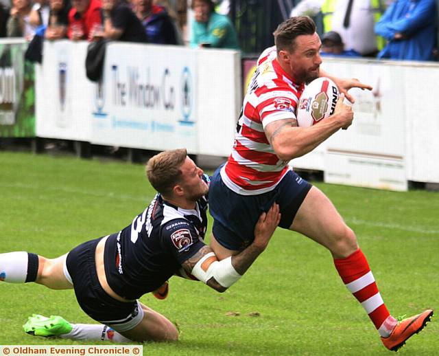 ON THE BURST . . . Danny Grimshaw, who would go off injured in the first half, tries to make a break. 
