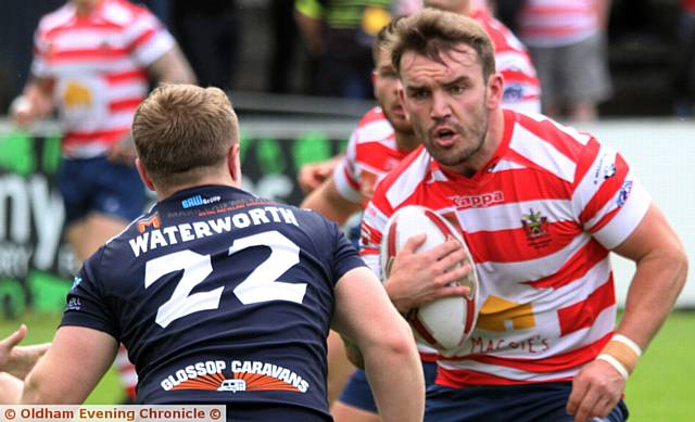 ATTACKING THE LINE . . . Oldham's Jack Spencer on the charge