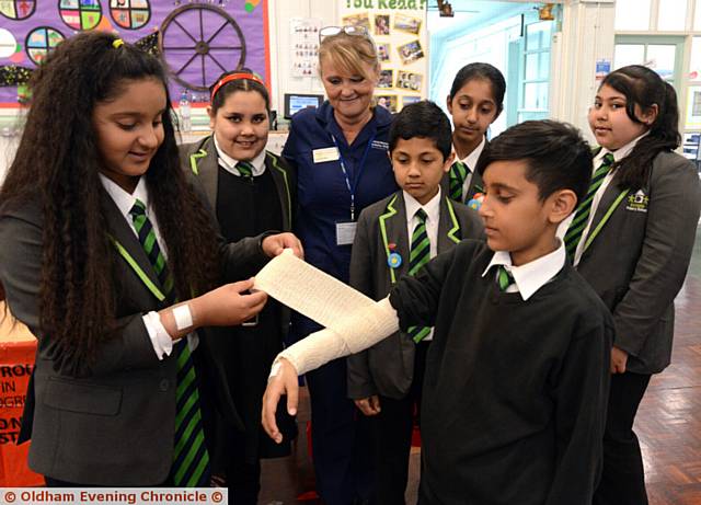 NURSE Lisa Donnelly, from Central Manchester University Hospitals, with (from left) Aneeka Hussain, Muneeba Ahmed, Tamjud Uddin, Iqra Ahmad, Isa Ahmed and Aysha Shafiq