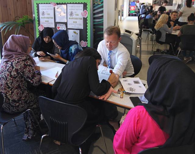 TRIBUTE . . . Oldham Sixth Form College deputy principal Peter Roberts gets a henna bee