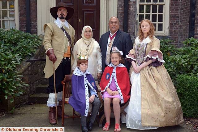 ROYALTY . . . 

Prince and Princess of Chadderton Ewan Bissell (9) and Charlotte Wood (9) are crowned, with (from left) Michael Molcher playing William Radcliffe, Deputy Mayor and Mayoress of Oldham Councillor Javid Iqbal and Tasleem Akhtar and Claire Bradburn plays Margaret Radcliffe
