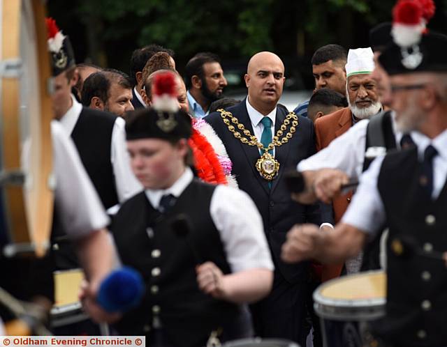 THE Oldham Scottish Pipe Band leads the Mayor, Cllr Shadab Qumer, to the Pakistani Community Centre