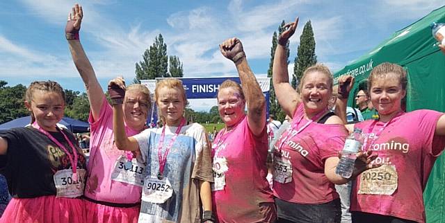 DAWN Nisbet with her Oldham team after completing Cancer Research UK's Pretty Muddy challenge