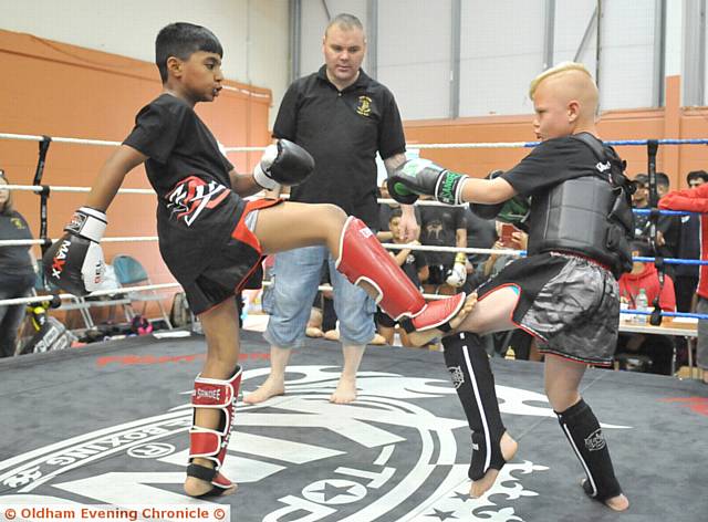 FRONT FOOT . . . Hashir Tariq (10) of Team Taz (left) takes on Leighton Hilsley (8) of Kearsley Thai