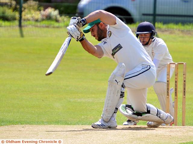 PUSHING TO THE OFFSIDE . . . Oldham opening batsman Junaid Khan.