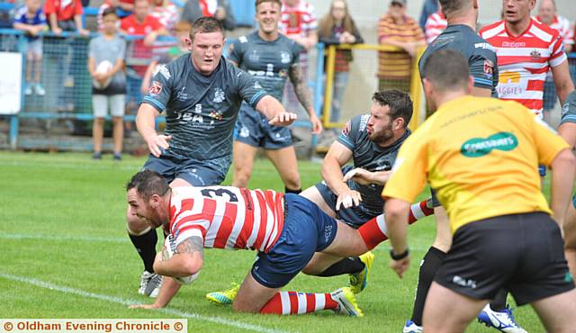 FIRST TRY: Dan Smith gets over the line for Oldham