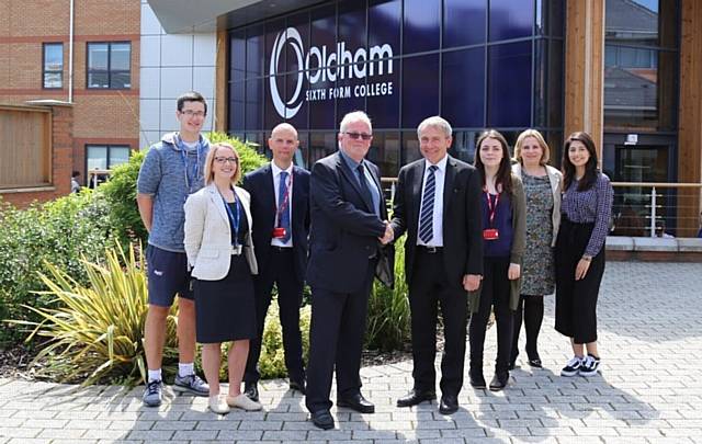 CHILDREN and Families Minister Robert Goodwill (centre right) shakes hands with Oldham Sixth From College chairman of governors Andrew Kilburn
