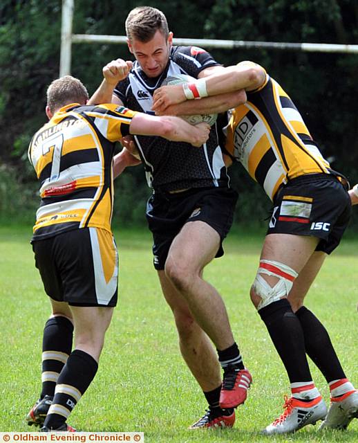 TWO AGAINST ONE . . . Rangers' Sam Hart is outnumbered TWO AGAINST ONE . . . Rangers' Sam Hart is outnumbered