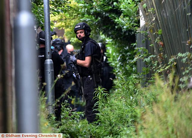 POLICE on scene . . . after reports of a gunman inside a house in Shaw