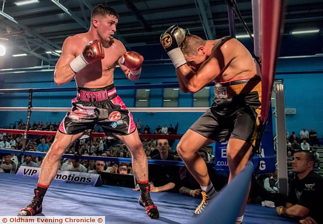 ON THE FRONT FOOT . . . Mark Heffron (left) pins Istvan Zeller against the ropes