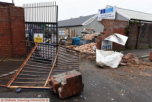 CRASHING through . . . the wagon sped down the road after crashing through this gate and part of a wall