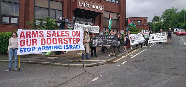 PROTESTERS gather outside the factory 