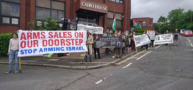 PROTESTERS gather outside the factory PROTESTERS gather outside the factory
