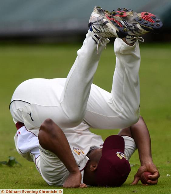 GOT HIM! . . . Crompton fielder Denis Louis catches Michael Harling...
