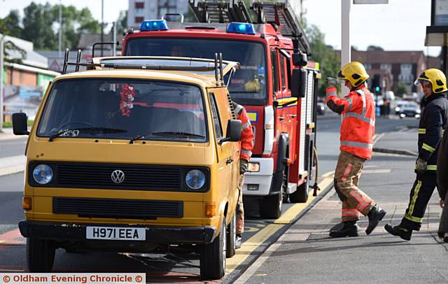 VW van engine fire on Huddersfield Road, Oldham. Fire service attend.