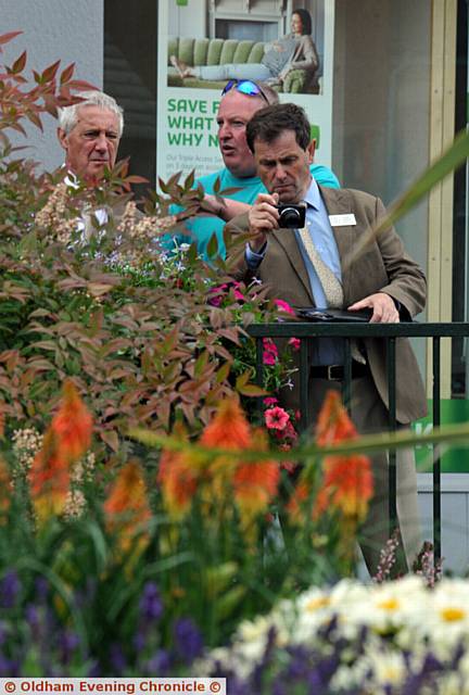 Britain in Bloom judging in and around Oldham. Pic shows Jim Goodwin (judge), left and Roger Burnett (chairman Britain in Bloom judging panel), right with Lee Gannon (Oldham gardening team leader).
