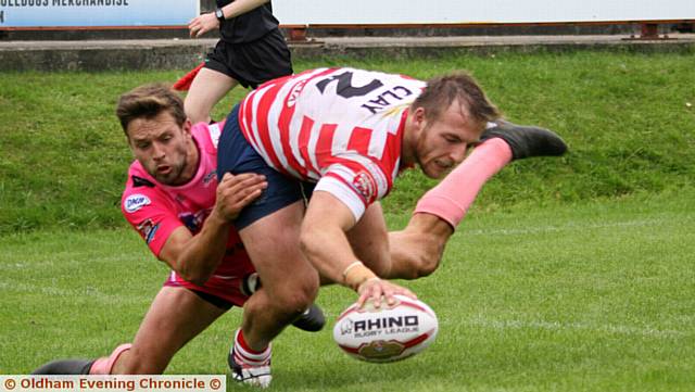 TOUCHDOWN . . . Adam Clay scores Oldham's fourth try in the comeback against Batley.