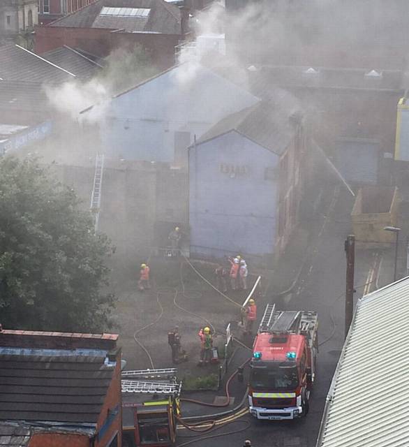 FIRE CREWS tackle the blaze at the former Scruples nightclub from the rear. Picture by Chronicle reader AARON WEST