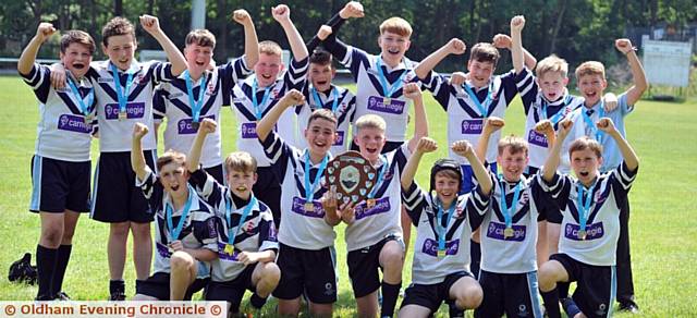 WHAT A BRILLIANT RESULT:the joyous Saddleworth team celebrate their hugely impressive victory
