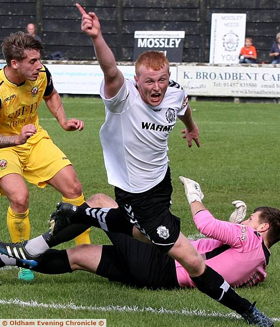 IT'S THERE . . . Adam Latham celebrates putting Mossley ahead.