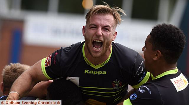 OH YES: Adam Clay celebrates Luke Hooley's match-clinching try at the Crown Oil Arena
