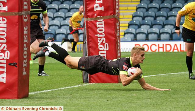 SEALED . . . Luke Hooley goes over the line to seal the victory
