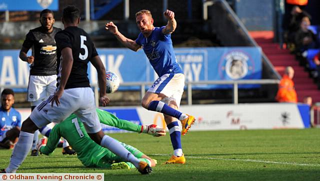 IN THE THICK OF THE ACTION . . . Paul Green with a near-miss for Athletic, while Aaron Amadi-Holloway (inset) gets to grips with a United rival. 