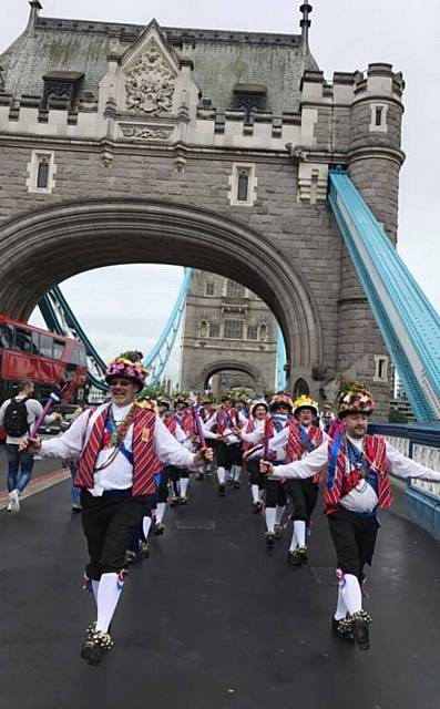 Saddleworth Morris men dance across Tower Bridge