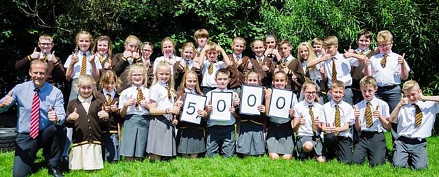 DEPUTY head teacher Steve Hill and his Year 6 class who have raised £5,000 for charity