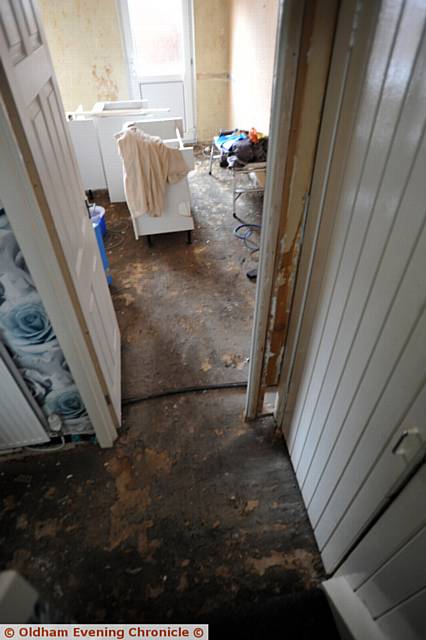 WATER damage . . . caused by a burst next door