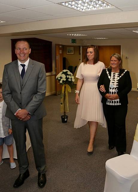 BRIDE-to-be Lisa Wroe is given away by Saddleworth parish council chairman Nicola Kirkham BRIDE-to-be Lisa Wroe is given away by Saddleworth parish council chairman Nicola Kirkham