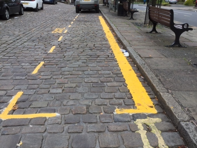 The lines, marking out a new hackney carriage rank in Uppermill's cobbled square.