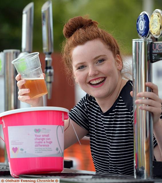 Pulling pints at the bar is Helena Stanway