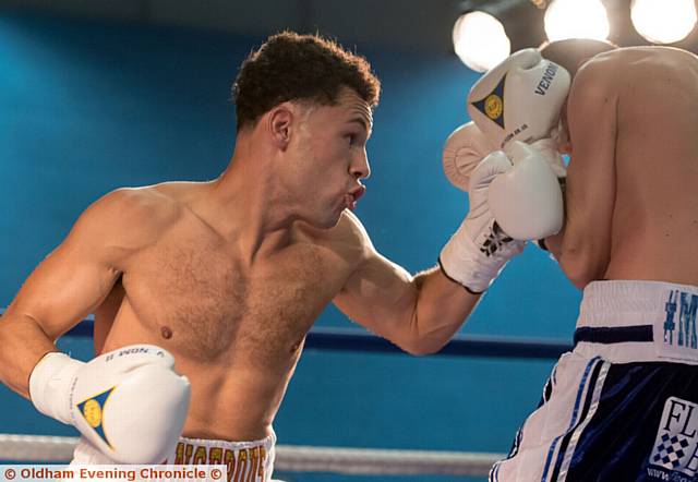 ON THE ATTACK . . . Joe Eko (left) lands a left hand on Kristian Laight
