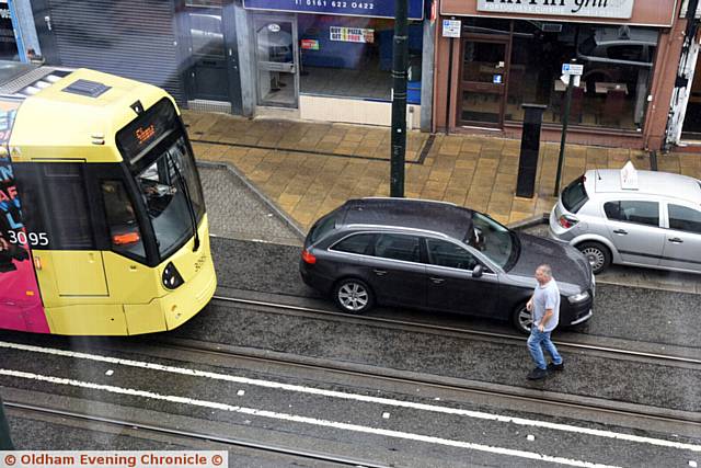 Driver parked on tram tracks on Union Street, Oldham.
