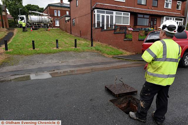 Sink hole on Acre Lane, Derker. Council workers establish it is likely to be a mains collapse and therefore United Utilities' responsibility.