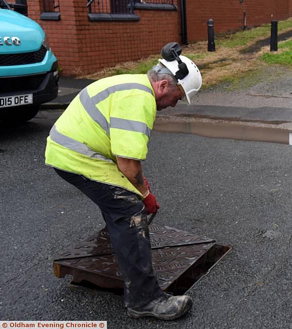 Sink hole on Acre Lane, Derker. Council workers establish it is likely to be a mains collapse and therefore United Utilities' responsibility.