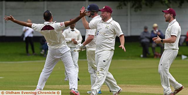 FIRST BLOOD . . Opening bowler Aqib Zulfiqar receives the acclaim of his Crompton teammates after trapping Rochdale's Ben Chapman leg before in the second over of the match. FIRST BLOOD . . Opening bowler Aqib Zulfiqar receives the acclaim of his Crompton teammates after trapping Rochdale's Ben Chapman leg before in the second over of the match.