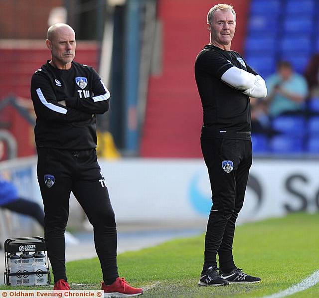 EYEING A VICTORY FILLIP . . . Athletic manager John Sheridan