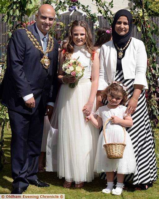 MAYOR of Oldham Cllr Shadab Qumer and Mayoress Sobia Arshi crowning the new queen Talulah Charlesworth with flower girl Poppy Barker-Chapman