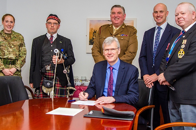 Sir David Dalton, chief executive of the Northern Care Alliance, signing the covenant Sir David Dalton, chief executive of the Northern Care Alliance, signing the covenant