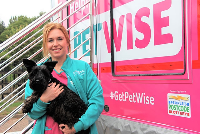 PDSA vet nurse Kristiana Shirley with Cooper the dog outside the new PetWise Mobile Unit
