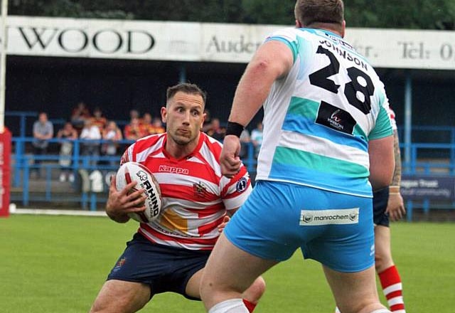 Oldham's Adam Neal will stay on at the Vestacare Stadium after retiring from playing Oldham's Adam Neal will stay on at the Vestacare Stadium after retiring from playing