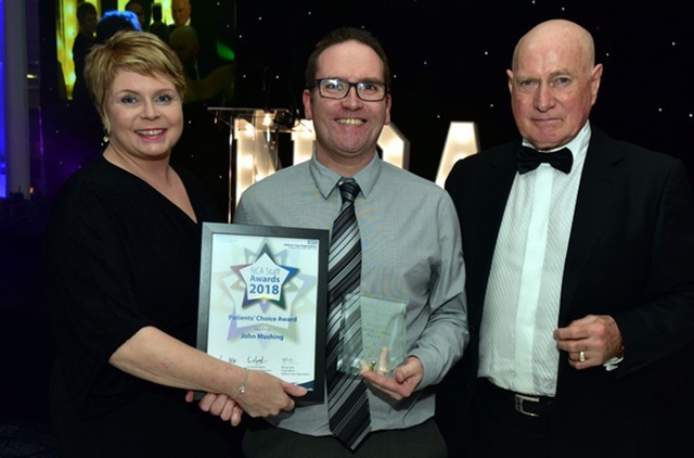 John Mushing, a porter at the Royal Oldham's pharmacy department (centre), receives his Patients’ Choice Award John Mushing, a porter at the Royal Oldham's pharmacy department (centre), receives his Patients’ Choice Award