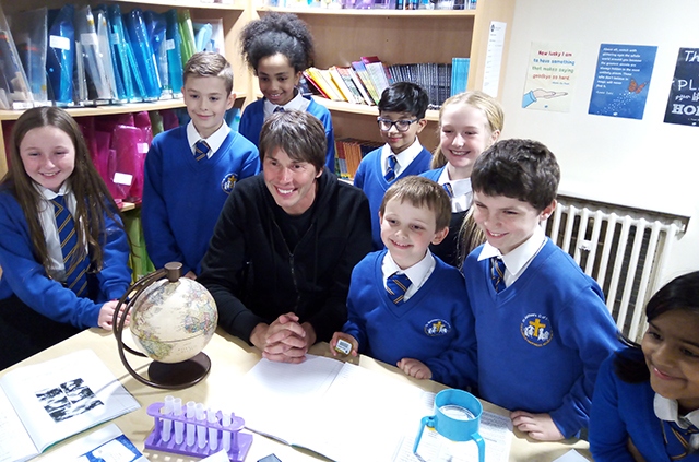 Pictured with Professor Brian Cox are Luca Read, Ameera Alam, Isaac Collier, Millie Griffiths, Rohaan Zia, Kyra Atkinson, Roni Etugo and Cory Dixon