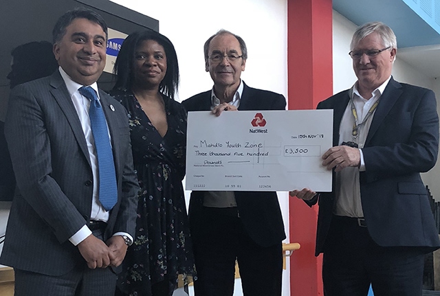 Oldham Business Awards steering group members Kashif Ashraf, Dawn Torrington and Martyn Torr present a cheque to Mike Doran (right), chief executive of Mahdlo Oldham Business Awards steering group members Kashif Ashraf, Dawn Torrington and Martyn Torr present a cheque to Mike Doran (right), chief executive of Mahdlo