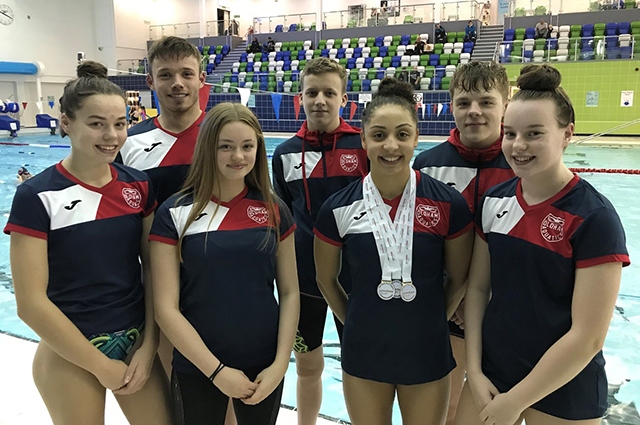 The Oldham Aquatics team pictured at the Swim England North West Winter Championships. They are (left to right): Kimberley Burston, Sam Goldrick, Amy Harrison, Kian Tevlin, Jessica Calderbank, Luke Kearslake and Ellie Lomax The Oldham Aquatics team pictured at the Swim England North West Winter Championships. They are (left to right): Kimberley Burston, Sam Goldrick, Amy Harrison, Kian Tevlin, Jessica Calderbank, Luke Kearslake and Ellie Lomax