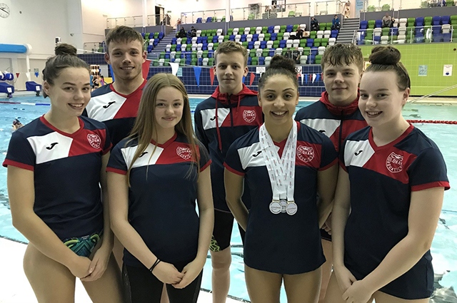 The Oldham Aquatics team pictured  at the Swim England North West Winter Championships. They are (left to right): Kimberley Burston, Sam Goldrick, Amy Harrison, Kian Tevlin, Jessica Calderbank, Luke Kearslake and Ellie Lomax 