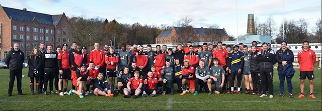 Hopwood Hall College students and Salford Red Devils staff and players line up